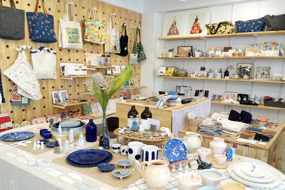 Craft and hobby shop counter with yarn, paper, and craft supplies