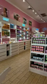 Beauty supply store interior with shelves of cosmetics and hair care products