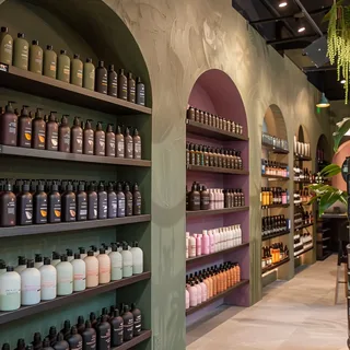 Beauty supply store interior with shelves of cosmetics and hair care products